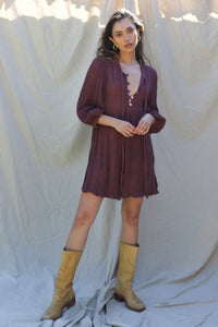 merlot gauze mini dress with three quarter length sleeves and a button up bodice