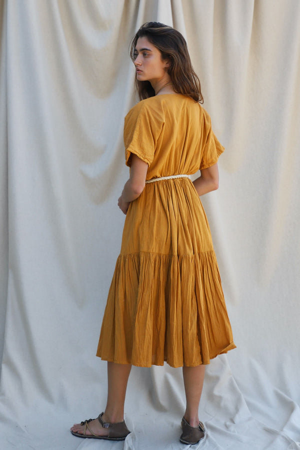 gold midi dress with voluminous skirt and short sleeves